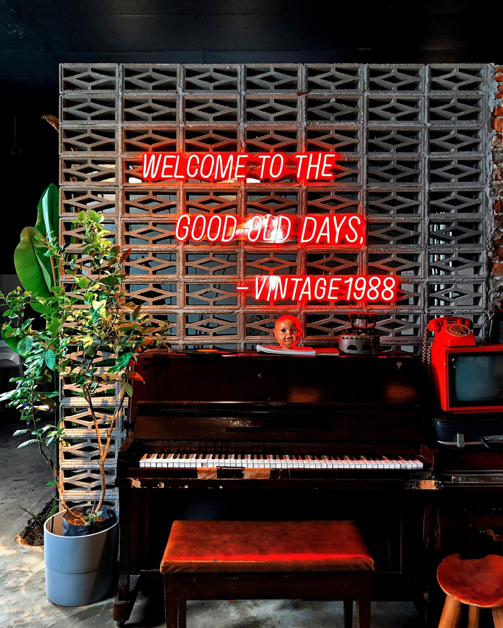 brown wooden grand piano with red and white text